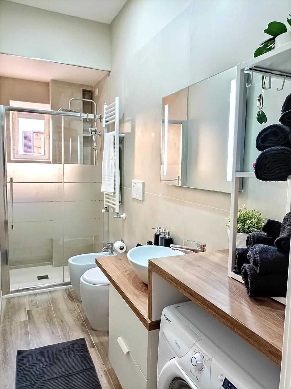 Toilet, Bathroom, bidet, towels, washing machine, dryer