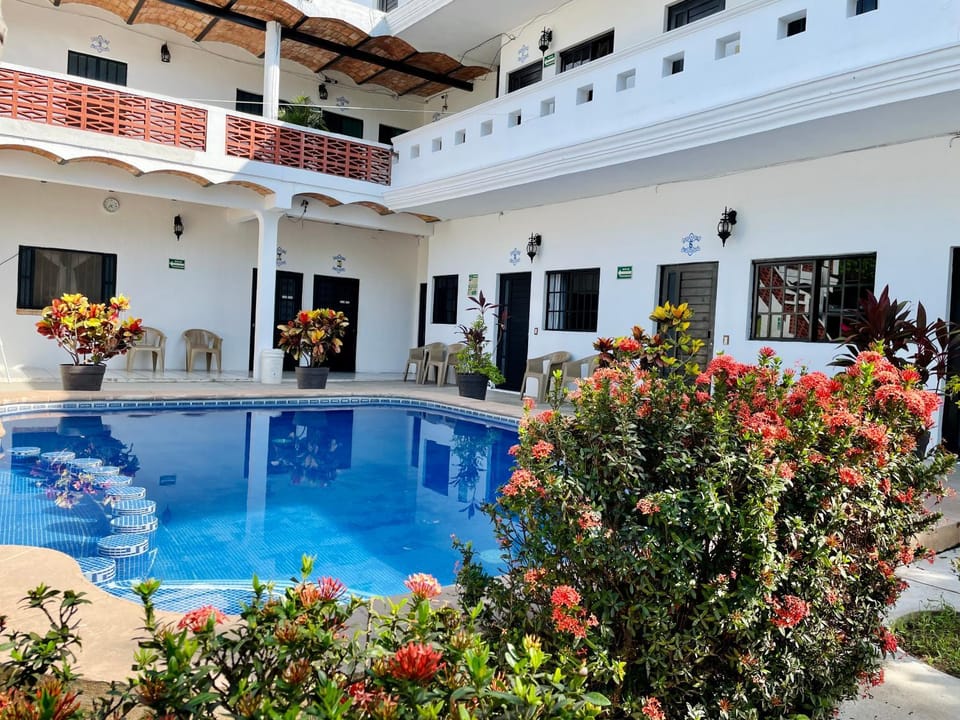Property building, Patio, Day, View (from property/room), Pool view, Swimming pool