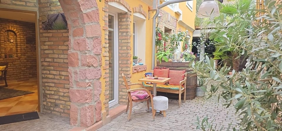 Property building, Patio, Day, Seating area