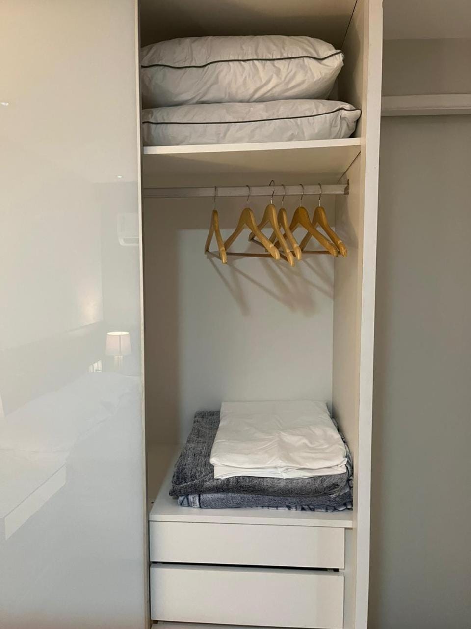 Bed, towels, wardrobe