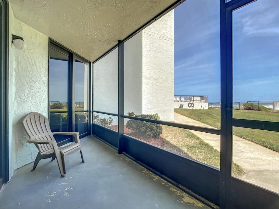 Beachfront with a pool at Ocean Trillium Condo ~ 101 Apartment in New Smyrna Beach