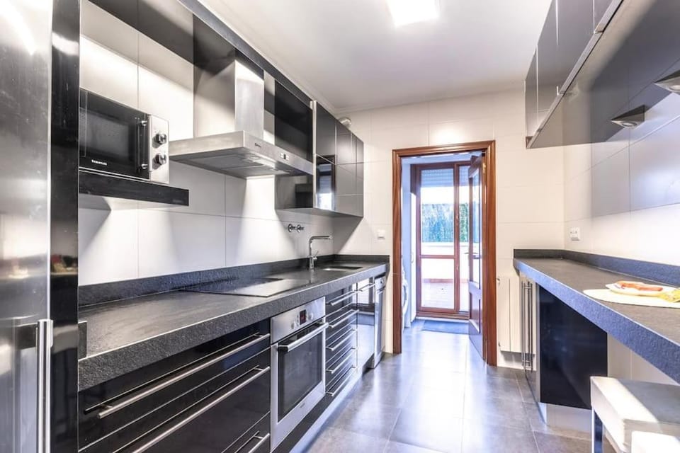 Kitchen or kitchenette, dishwasher, oven, stove