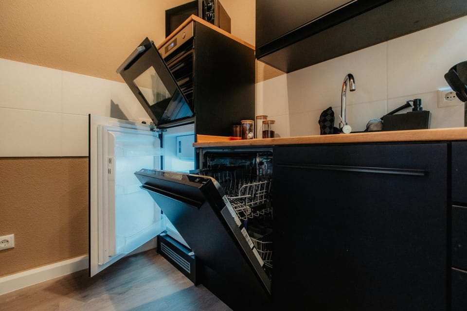 Kitchen or kitchenette, dishwasher, oven, stove, toaster