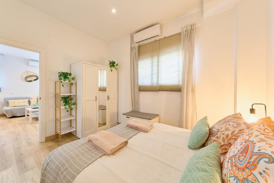 Bed, towels, wardrobe