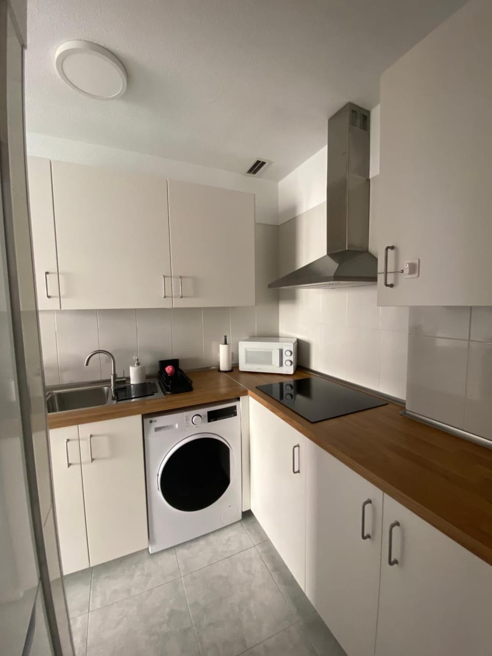 Kitchen or kitchenette, washing machine