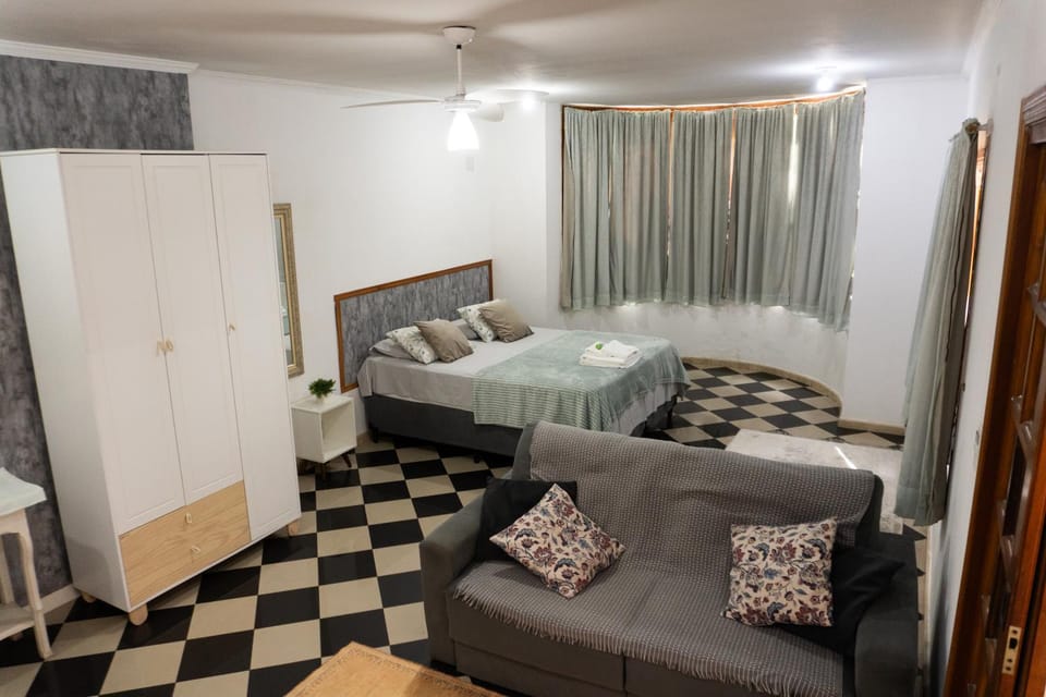 Bed, Seating area, wardrobe