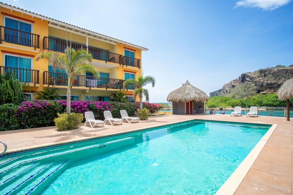 Property building, Day, Natural landscape, Pool view, Swimming pool, sunbed