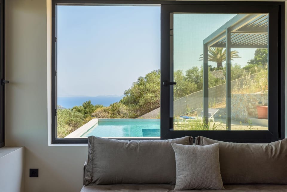Natural landscape, View (from property/room), Living room, Seating area, Pool view, Sea view, Swimming pool