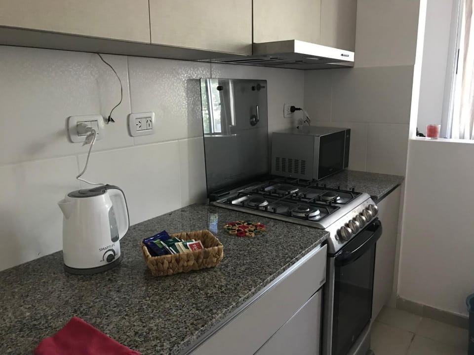 Kitchen or kitchenette, microwave, oven, toaster