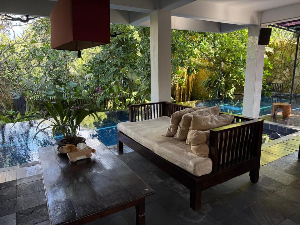 Patio, Living room, Seating area, Pool view