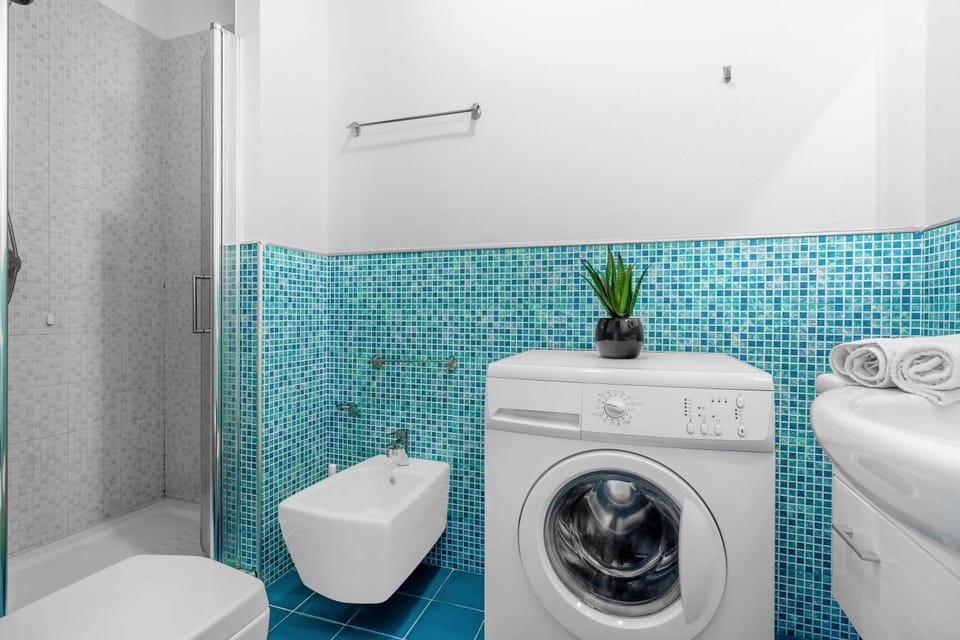 Shower, Toilet, Bathroom, bidet, towels, washing machine