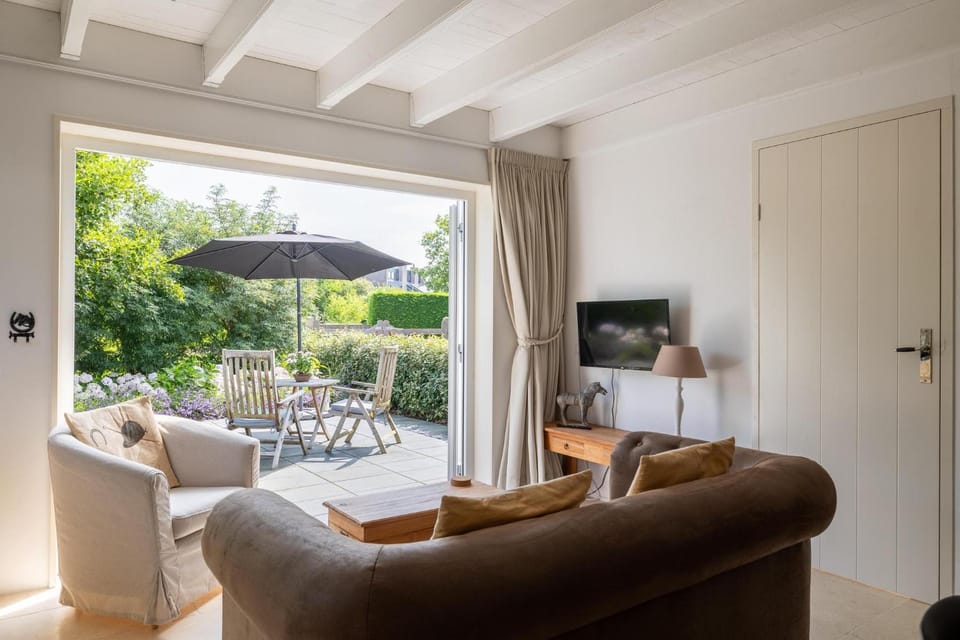 Welcome in - Vrijstaande vakantiehuis 'Het Koetshuys' met tuin I Sloestraat 38 House in Zoutelande