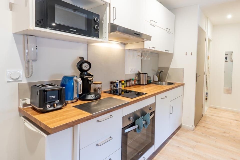 Kitchen or kitchenette, dishwasher, microwave, oven, stove, toaster