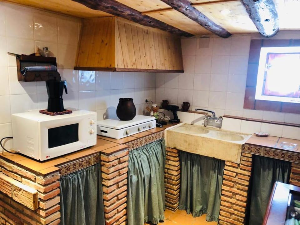 Kitchen or kitchenette, microwave, stove, toaster