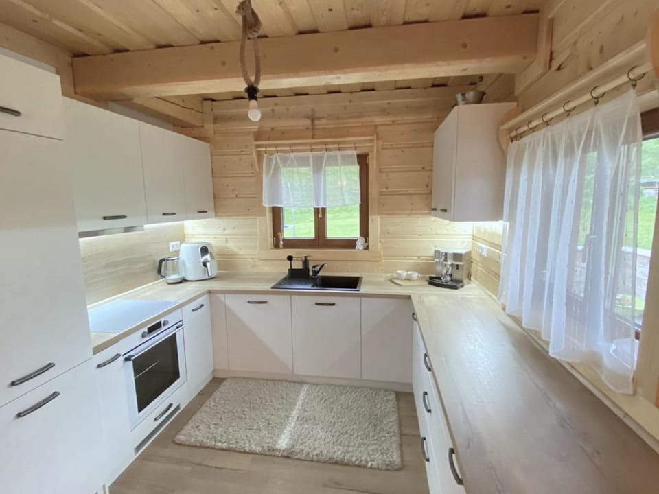 Kitchen or kitchenette, dishwasher, oven, stove, toaster