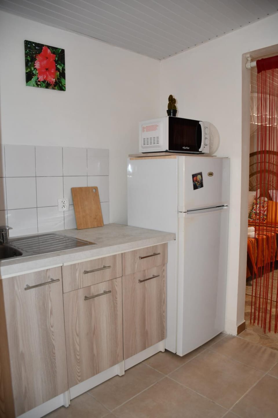 Kitchen or kitchenette, microwave, storage