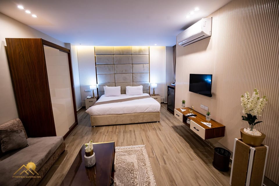 Bed, TV and multimedia, Living room, Photo of the whole room, Seating area, Bedroom, hair dresser, wardrobe, air conditioner