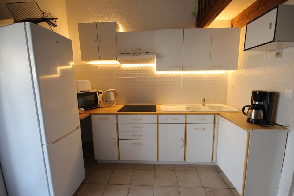 Kitchen or kitchenette, stove