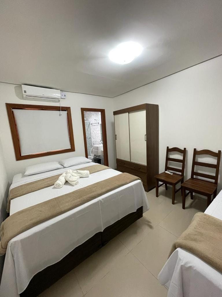 Bed, Photo of the whole room, Seating area, Bedroom, towels, wardrobe, air conditioner
