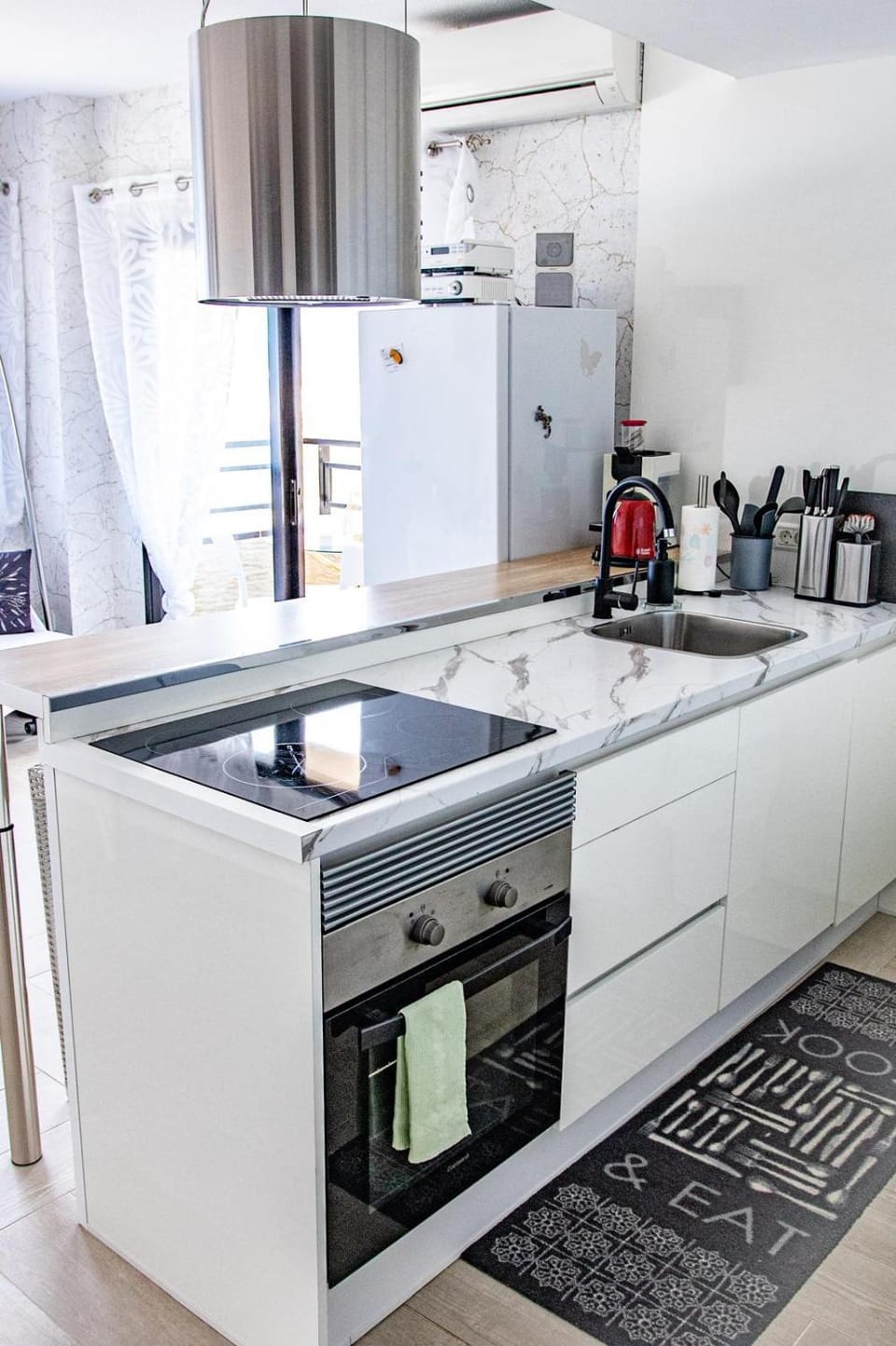 Kitchen or kitchenette, dishwasher, oven, stove