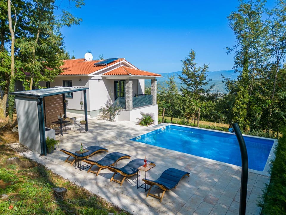 Property building, Patio, Spring, Day, Natural landscape, Pool view, Sea view, Swimming pool, sunbed