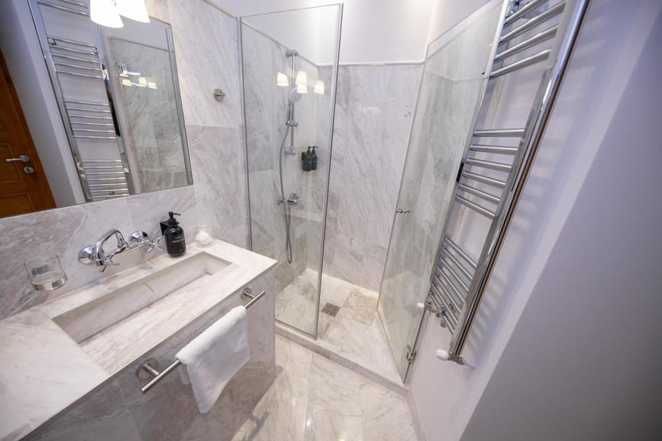 Shower, Toilet, Bathroom, hair dryier, towels