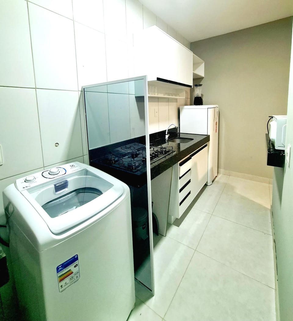 Kitchen or kitchenette, minibar, stove, washing machine