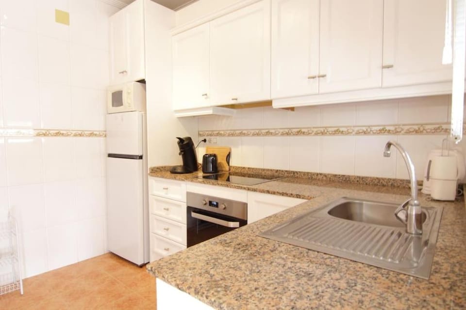 Kitchen or kitchenette, oven, toaster