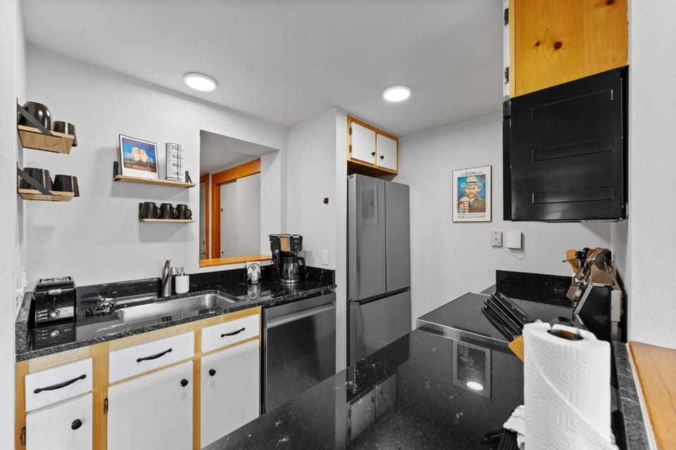Kitchen or kitchenette, dishwasher, furniture, microwave, oven, kitchen