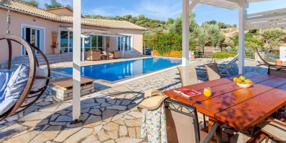 Property building, Patio, Pool view, Swimming pool, sunbed