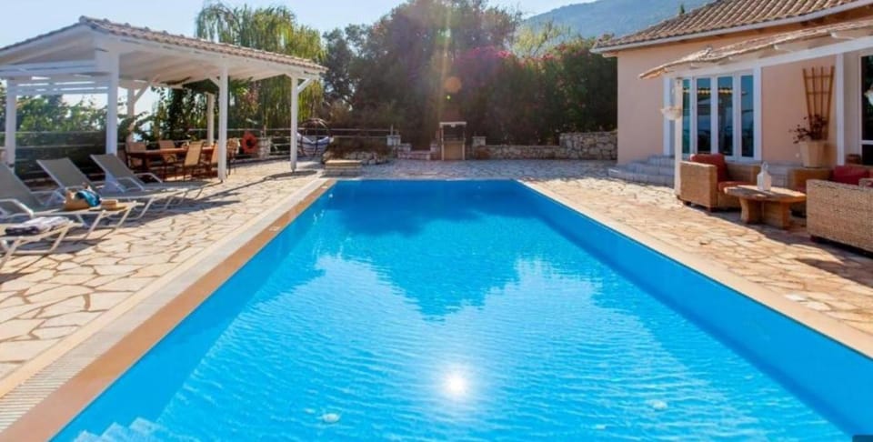 Property building, Patio, Day, Natural landscape, Mountain view, Pool view, Sea view, Swimming pool, sunbed