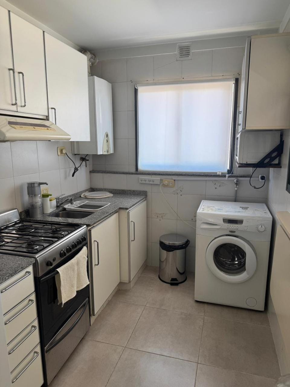 Kitchen or kitchenette, washing machine