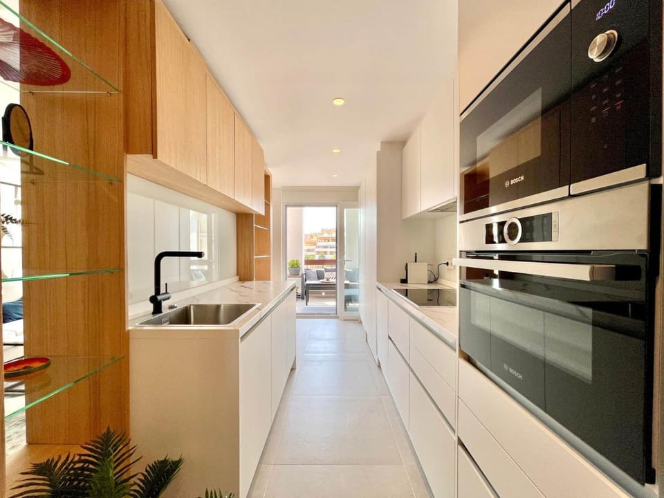 Kitchen or kitchenette, dishwasher, oven, stove