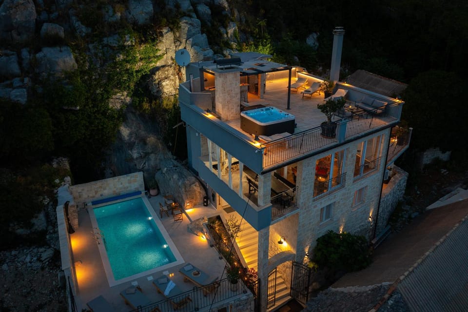 Property building, Patio, Night, Swimming pool, sunbed