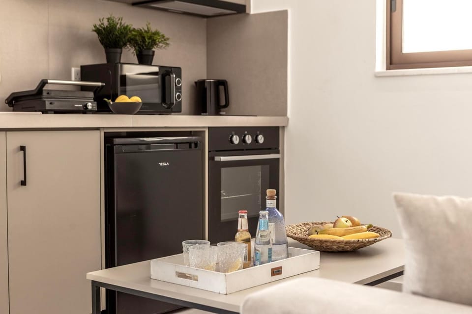 Kitchen or kitchenette, microwave, oven, stove