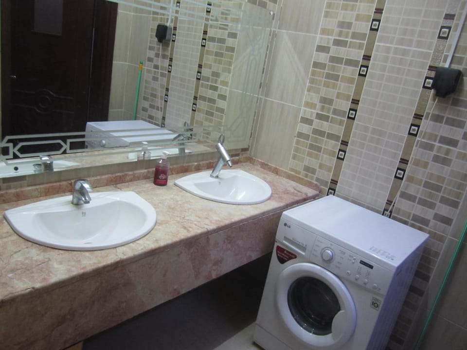 Toilet, Bathroom, towels, washing machine, dryer