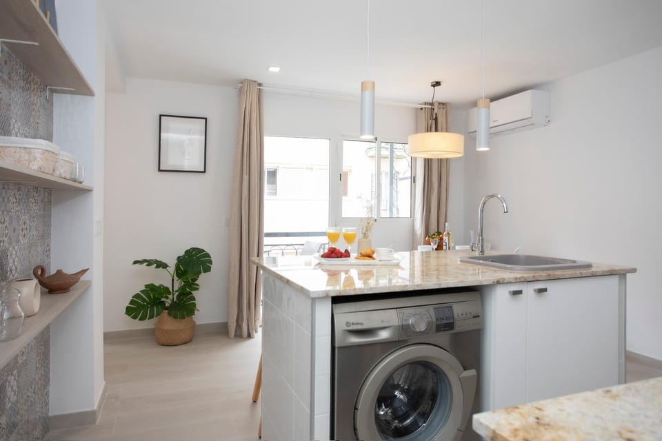 Kitchen or kitchenette, stove, washing machine
