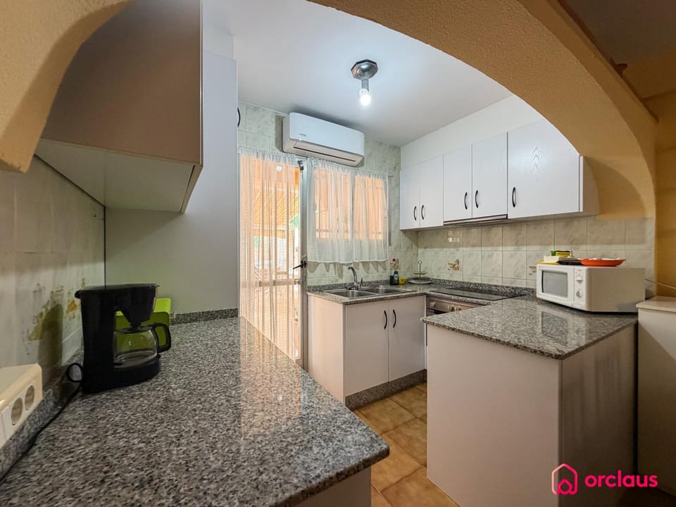 Kitchen or kitchenette, oven, air conditioner