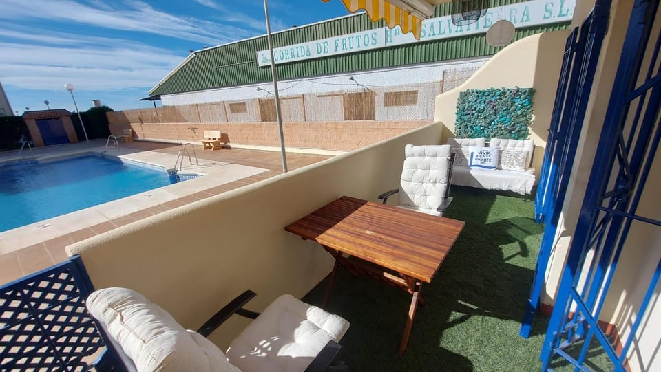 View (from property/room), Balcony/Terrace, Seating area, Pool view, Swimming pool