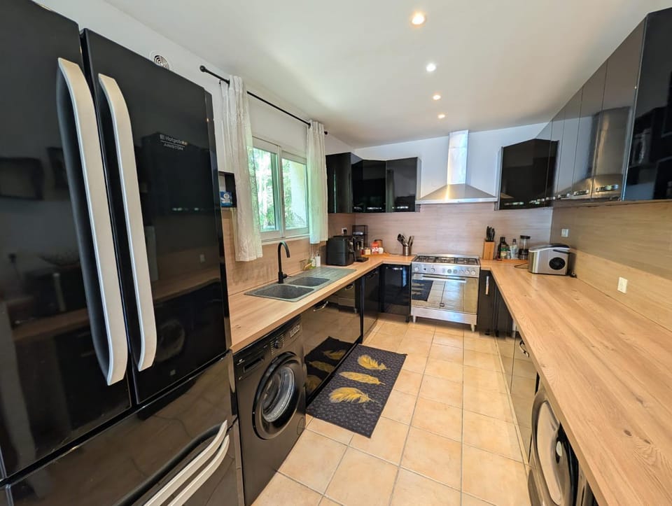 Kitchen or kitchenette, dishwasher, oven, stove, toaster
