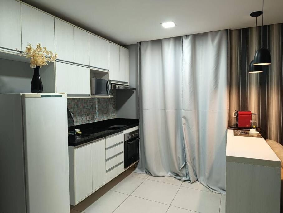 Kitchen or kitchenette, oven, stove