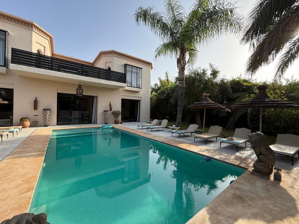 Property building, Patio, Pool view, Swimming pool, sunbed