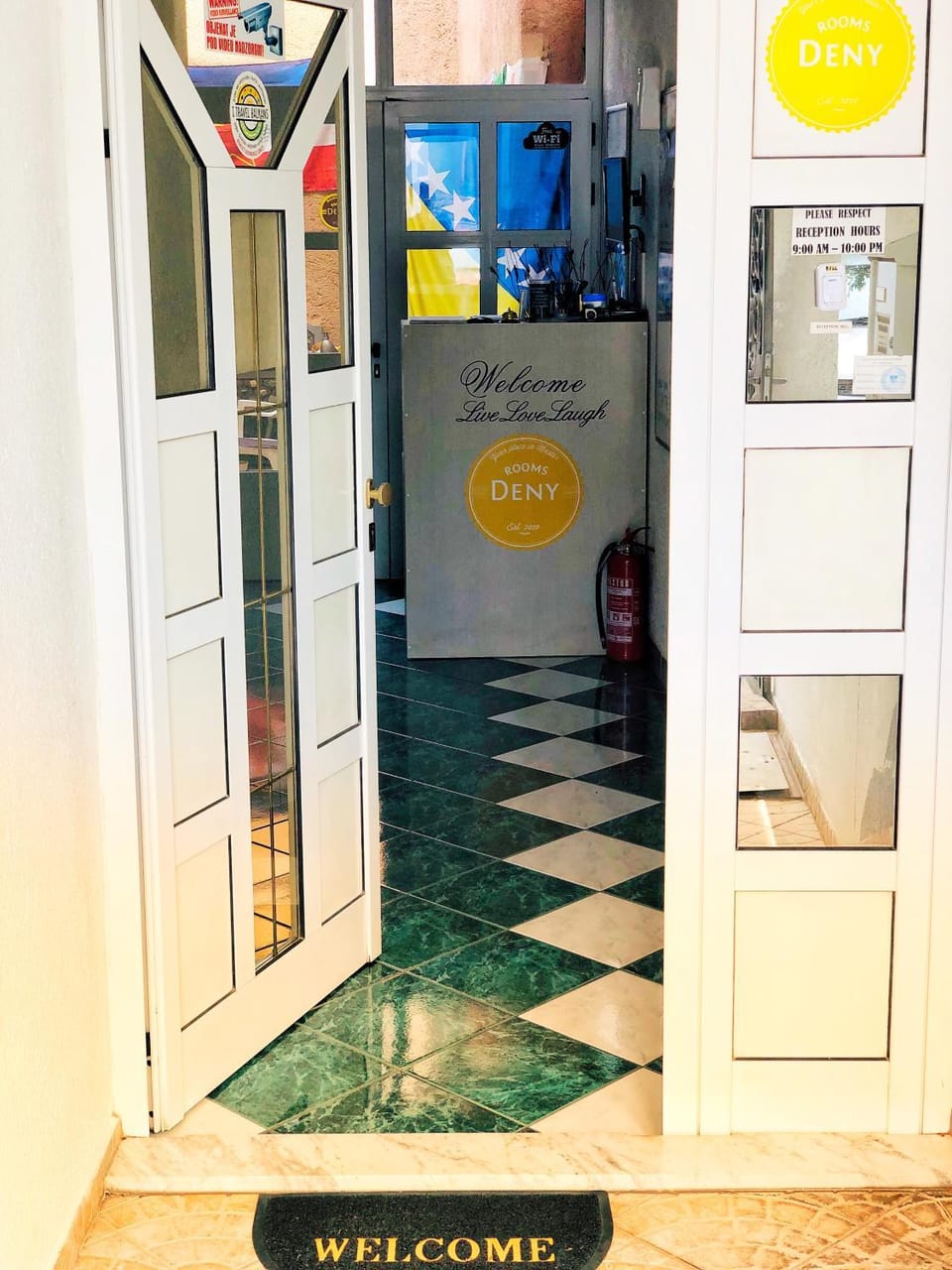 Staff, Communal lounge/ TV room, Facade/entrance, Property logo or sign, Lobby or reception, Food and drinks, Other, Decorative detail, Logo/Certificate/Sign, Certificate/Award