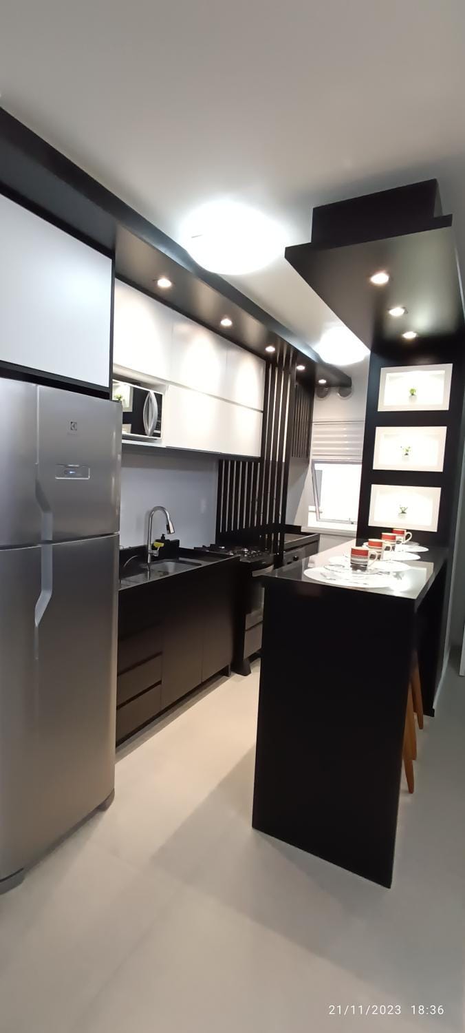 Kitchen or kitchenette, microwave, oven, stove, toaster, laundry, washing machine