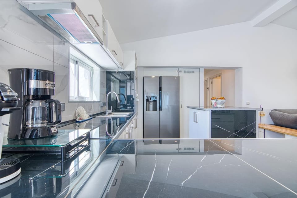 Kitchen or kitchenette, dishwasher, oven, stove