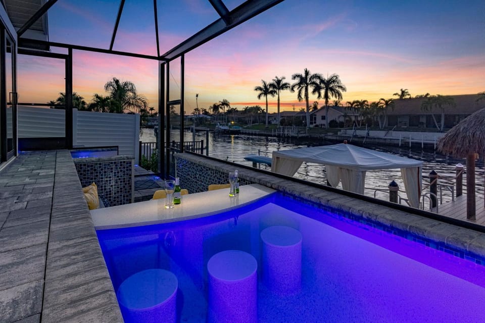 Kayaks, Boat Dock, Heated Pool & Spa, Outside Kitchen, Tiki Hut - Villa Pedro - Roelens Vacations House in Cape Coral