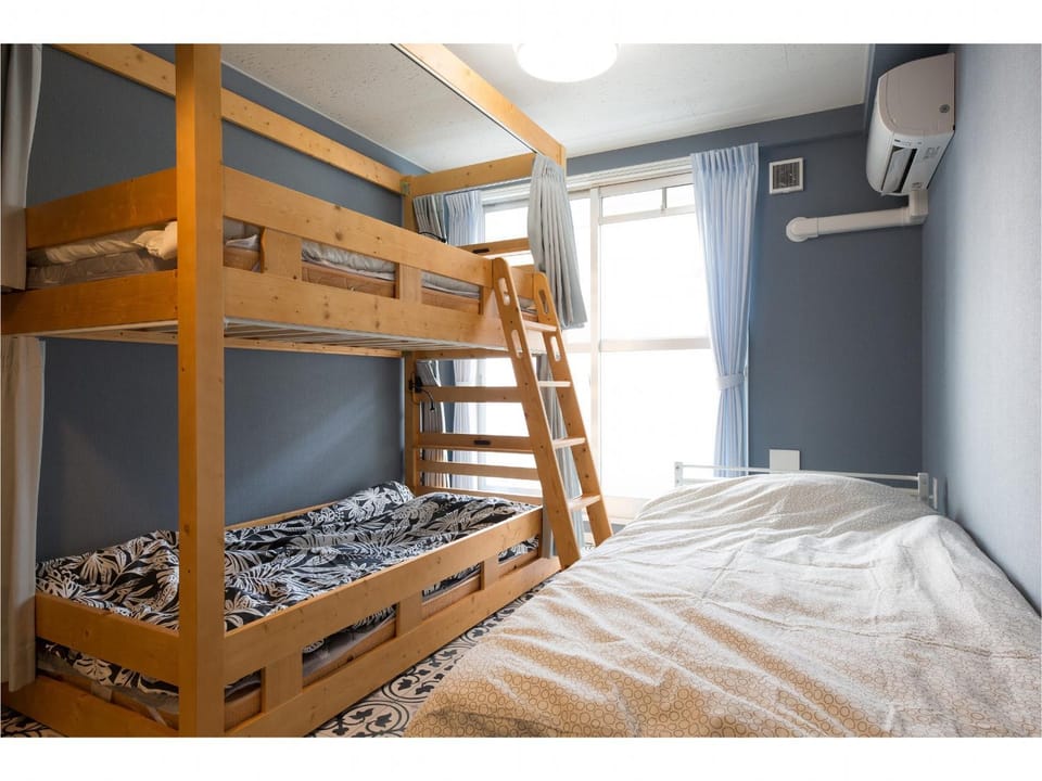 Photo of the whole room, bunk bed, air conditioner