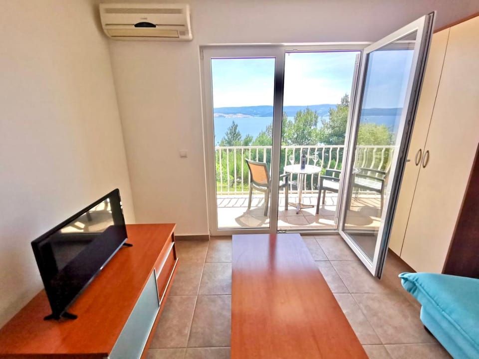 TV and multimedia, Living room, Seating area, Sea view, air conditioner