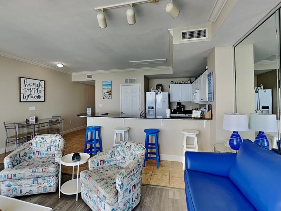 Kitchen or kitchenette, Living room, Seating area, Dining area, furniture, microwave, stove, air conditioner