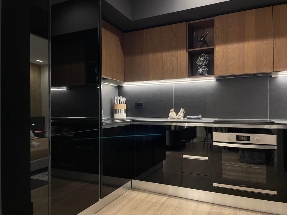 Kitchen or kitchenette, dishwasher, oven, stove